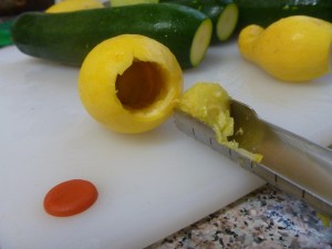 My CSA basket only gave me crookneck yellow squash. Although tasty, they are technically too small, in my opinion. But here you can see some fun squash gutting action!